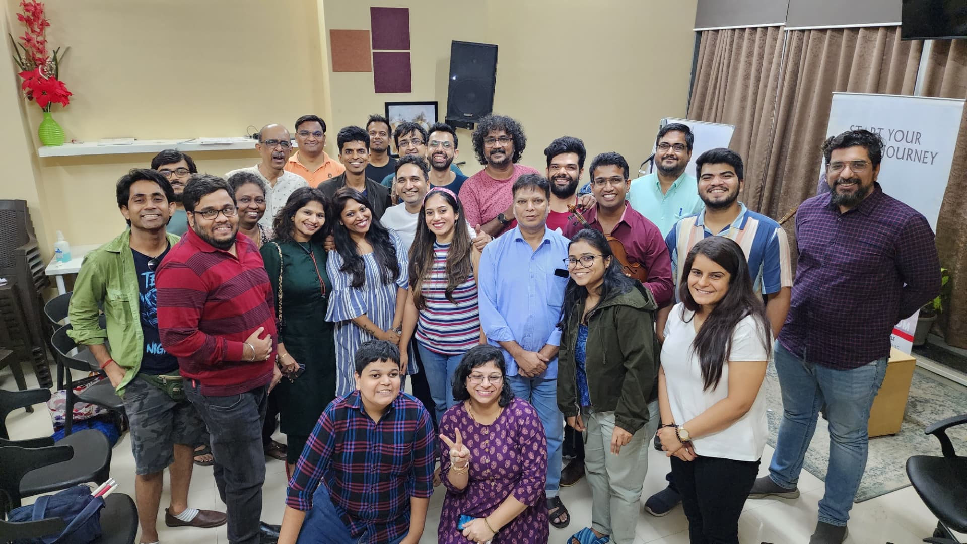 Music Jammin members posing together at a studio meet-up