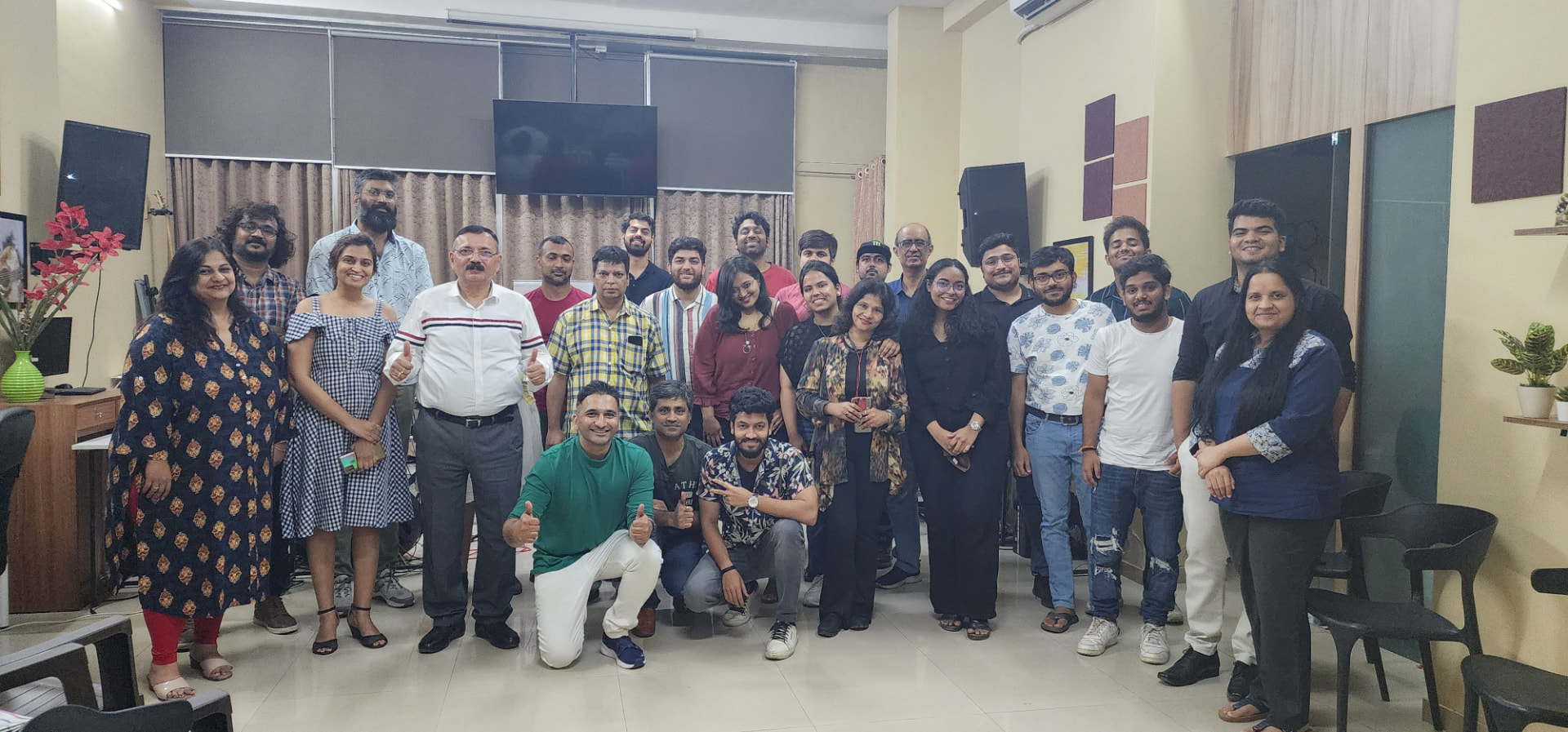 Group photo of Music Jammin artists at a rehearsal space